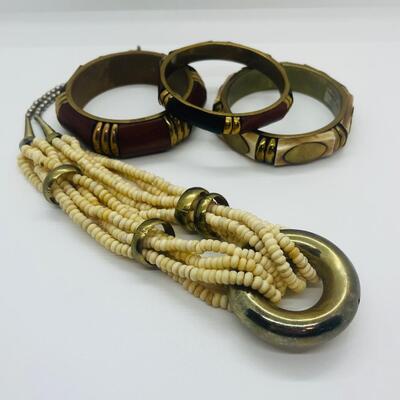 Lot 57: Vintage Multi Strand Beaded Necklace and 3 Bangle Bracelets w/Brass Accents