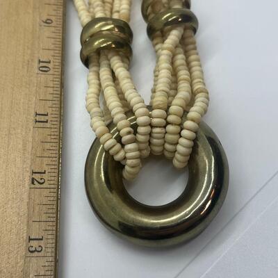 Lot 57: Vintage Multi Strand Beaded Necklace and 3 Bangle Bracelets w/Brass Accents