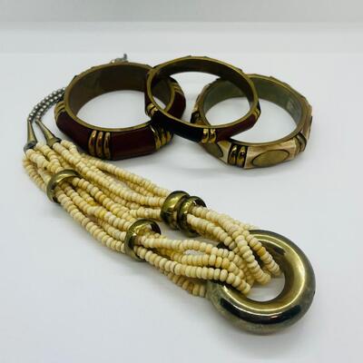 Lot 57: Vintage Multi Strand Beaded Necklace and 3 Bangle Bracelets w/Brass Accents