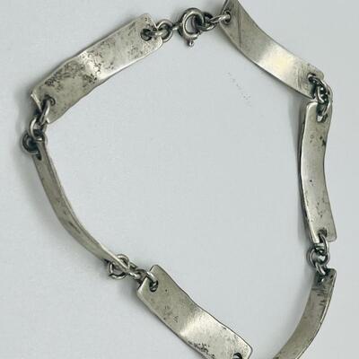 Lot 60: Silvertone Belt, Earrings and Bracelets