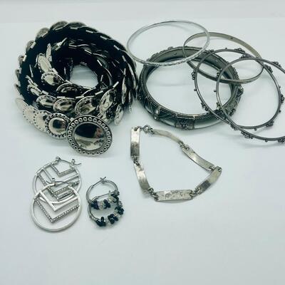 Lot 60: Silvertone Belt, Earrings and Bracelets
