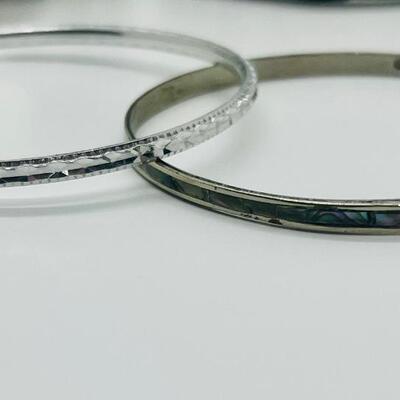 Lot 60: Silvertone Belt, Earrings and Bracelets