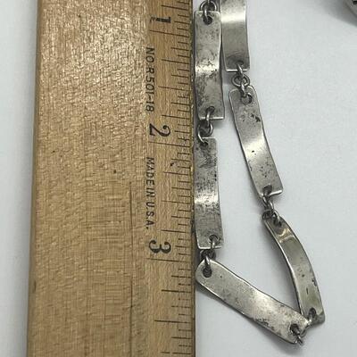 Lot 60: Silvertone Belt, Earrings and Bracelets