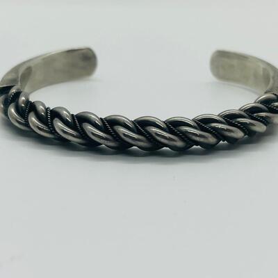 Lot 66: Vintage Chunky Sterling Silver Cuff Bracelet with Embellished Design.