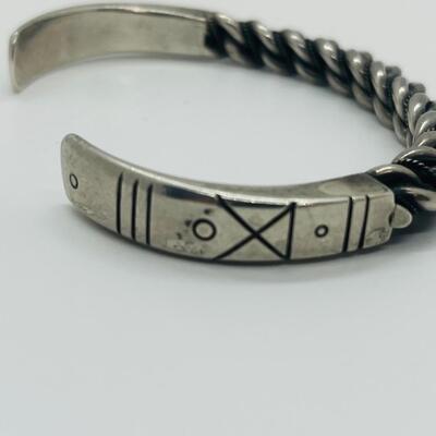 Lot 66: Vintage Chunky Sterling Silver Cuff Bracelet with Embellished Design.
