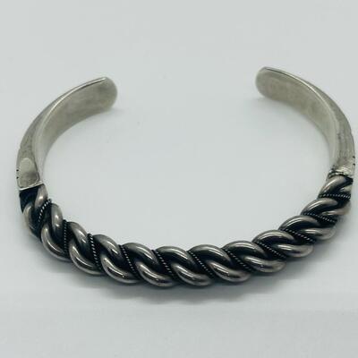 Lot 66: Vintage Chunky Sterling Silver Cuff Bracelet with Embellished Design.