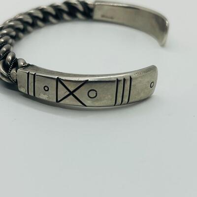 Lot 66: Vintage Chunky Sterling Silver Cuff Bracelet with Embellished Design.
