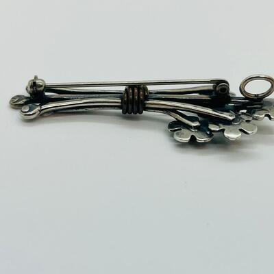 Lot 102: Sterling and copper Brooch, pendant and pierced earrings