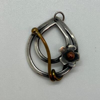 Lot 102: Sterling and copper Brooch, pendant and pierced earrings