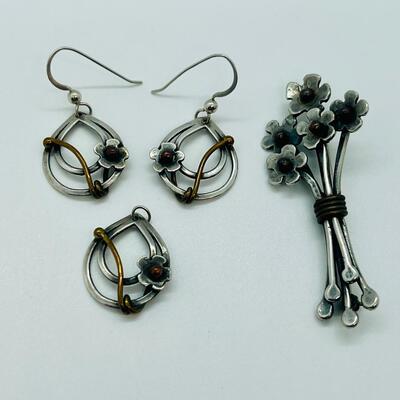 Lot 102: Sterling and copper Brooch, pendant and pierced earrings