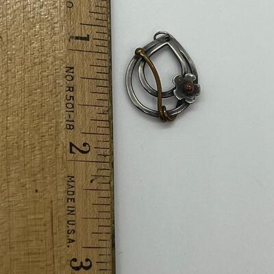 Lot 102: Sterling and copper Brooch, pendant and pierced earrings
