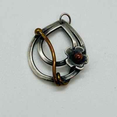 Lot 102: Sterling and copper Brooch, pendant and pierced earrings