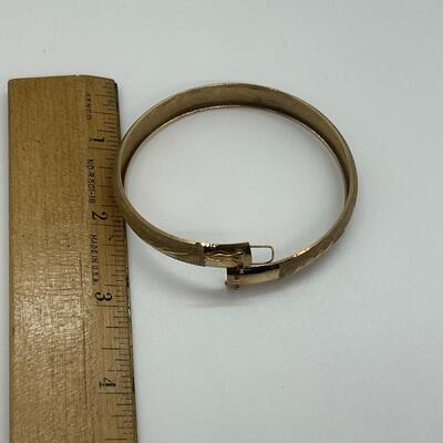 Lot 111: 10k Marked B&M Yellow Gold Latching Bangle Bracelet