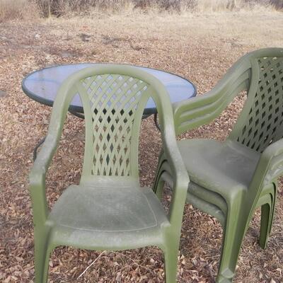 LOT 199  OUTDOOR TABLE AND CHAIRS