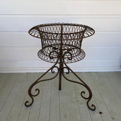 Large wrought iron planter on stand