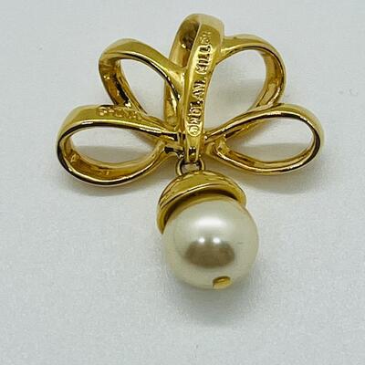 Lot 115: Three Nolan Miller Pendants