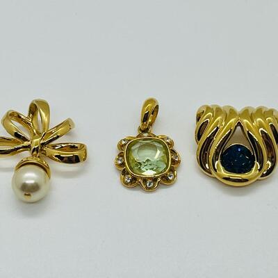 Lot 115: Three Nolan Miller Pendants