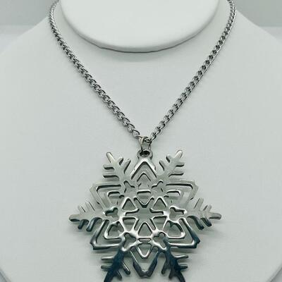 Lot 117: Reed and Barton Pewter Snowflake Pendant