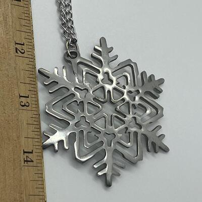 Lot 117: Reed and Barton Pewter Snowflake Pendant