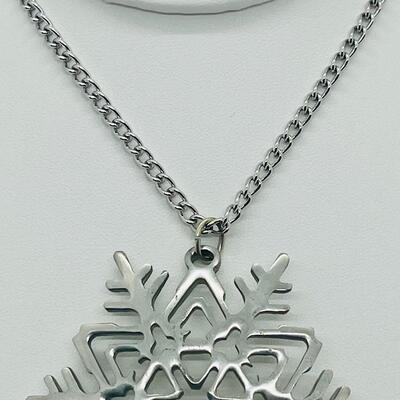 Lot 117: Reed and Barton Pewter Snowflake Pendant