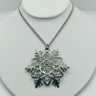 Lot 117: Reed and Barton Pewter Snowflake Pendant