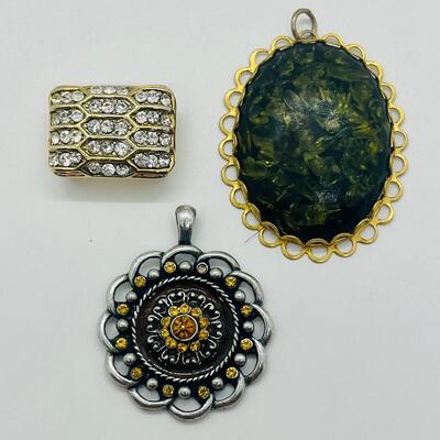 Lot 122: Three Costume Pendants