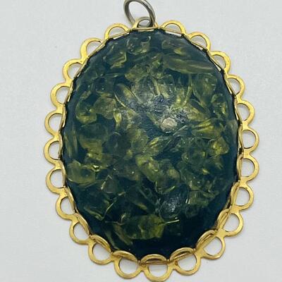 Lot 122: Three Costume Pendants