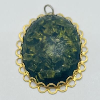 Lot 122: Three Costume Pendants
