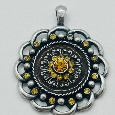 Lot 122: Three Costume Pendants