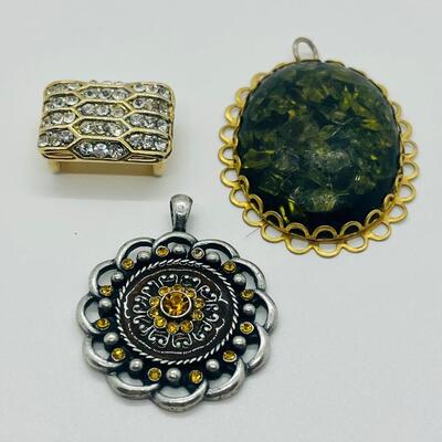 Lot 122: Three Costume Pendants