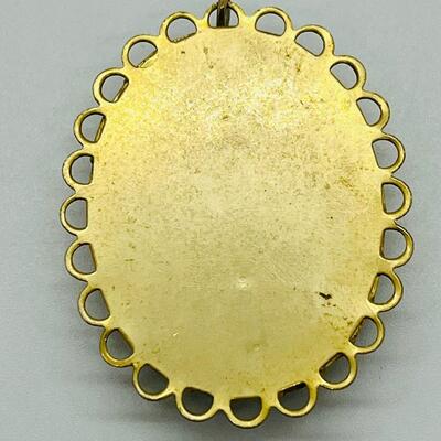 Lot 122: Three Costume Pendants