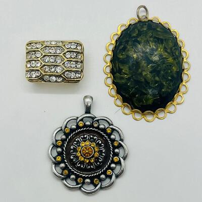 Lot 122: Three Costume Pendants