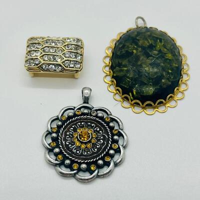 Lot 122: Three Costume Pendants