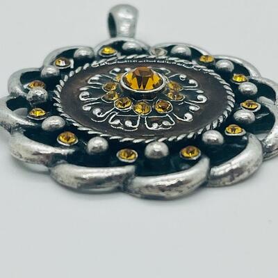 Lot 122: Three Costume Pendants