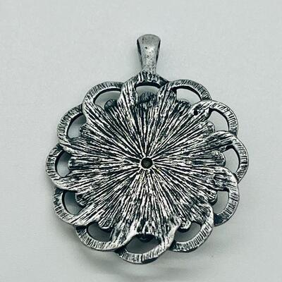 Lot 122: Three Costume Pendants