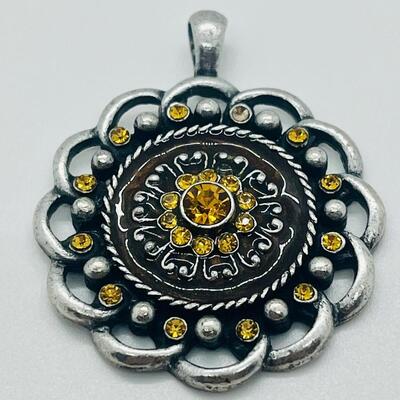 Lot 122: Three Costume Pendants