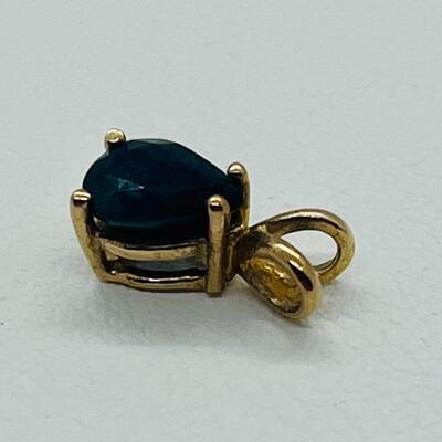 Lot 125: 10k gold lot- Blue Sapphire Pendant, CZ Solitaire & 2 Twist Rings