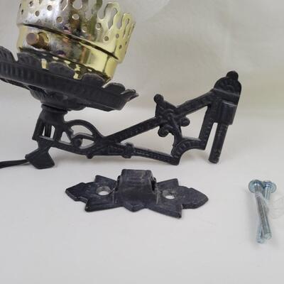 CAST IRON WALL OIL LAMP FIXTURE W/ ELECTRIC OIL LAMP STYLE LIGHT