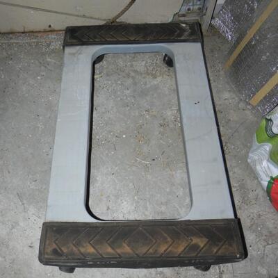 LOT 209  METAL TABLE ON CASTORS AND FURNITURE MOVER