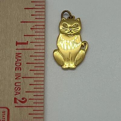 Lot 130: 3 crystal silvertone pendants and a goldtone Kitty