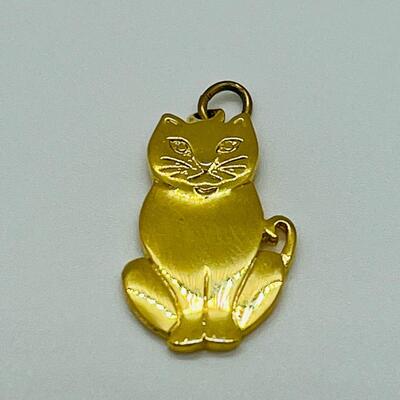 Lot 130: 3 crystal silvertone pendants and a goldtone Kitty