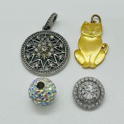 Lot 130: 3 crystal silvertone pendants and a goldtone Kitty