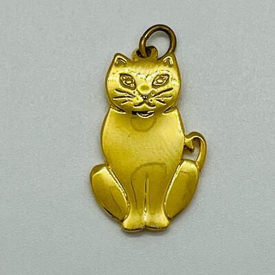 Lot 130: 3 crystal silvertone pendants and a goldtone Kitty