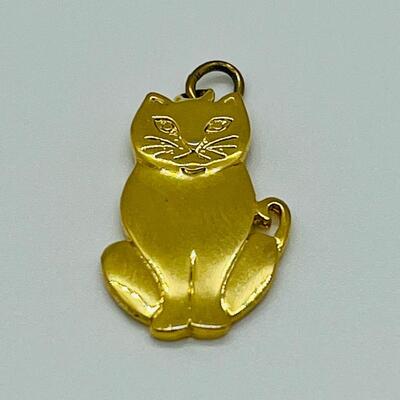 Lot 130: 3 crystal silvertone pendants and a goldtone Kitty