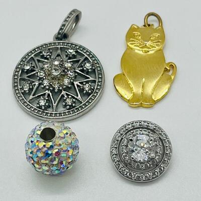 Lot 130: 3 crystal silvertone pendants and a goldtone Kitty