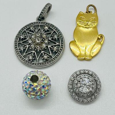 Lot 130: 3 crystal silvertone pendants and a goldtone Kitty