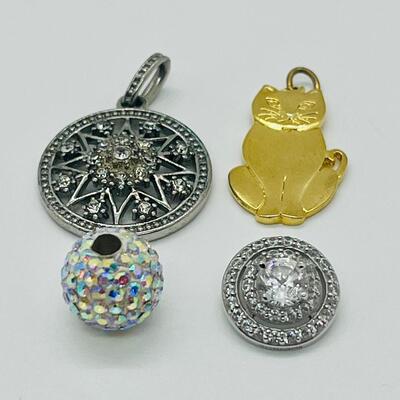 Lot 130: 3 crystal silvertone pendants and a goldtone Kitty