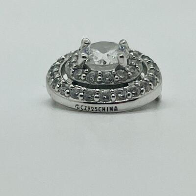 Lot 130: 3 crystal silvertone pendants and a goldtone Kitty