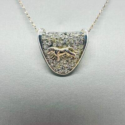 Lot 139: Silvertone Slider Pendant Covered in CZ's with Goldtone Panther