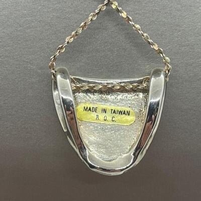 Lot 139: Silvertone Slider Pendant Covered in CZ's with Goldtone Panther